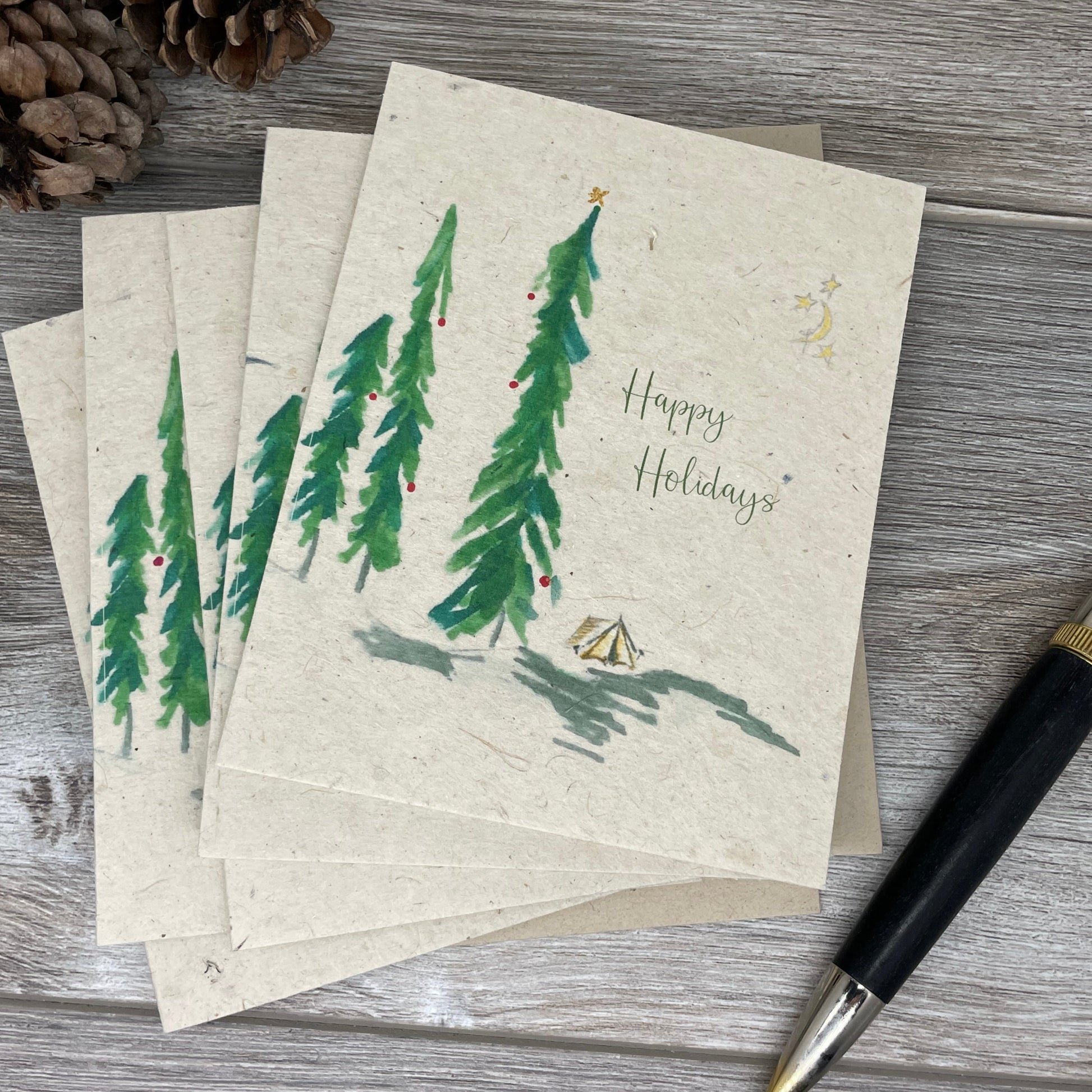 holiday card. christmas card. box set of christmas cards. unique christmas. christmas tree. vintage card. old fashioned card. plantable seed paper. plantable paper. 1 simple seed. outdoor. hiking. camping. minimalist card. adventure christmas.